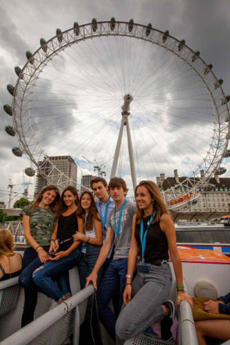 A group of Academic Summer Camps students in front of the London Eye.
