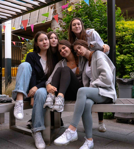 A group of girls in DLD College's garden in the centre of London opposite Big Ben